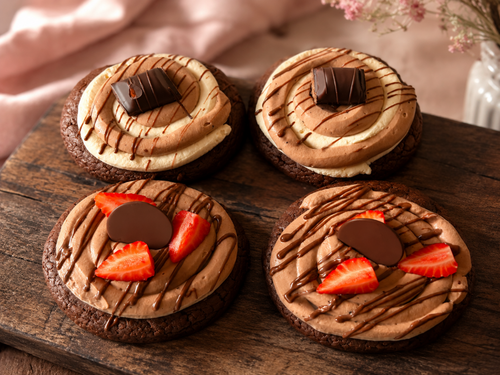 Luxury brownie cookies topped with chocolate cream, strawberries, chocolate drizzle and chocolate pieces